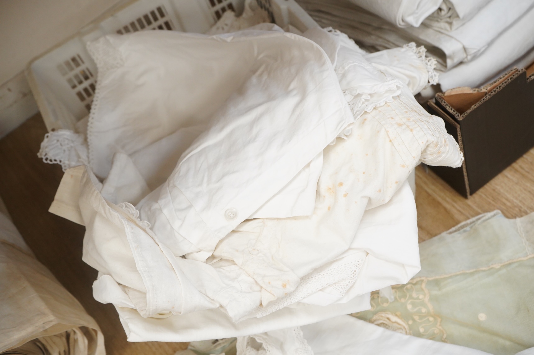 A collection of French mixed chemise and under garments and lace child’s dress